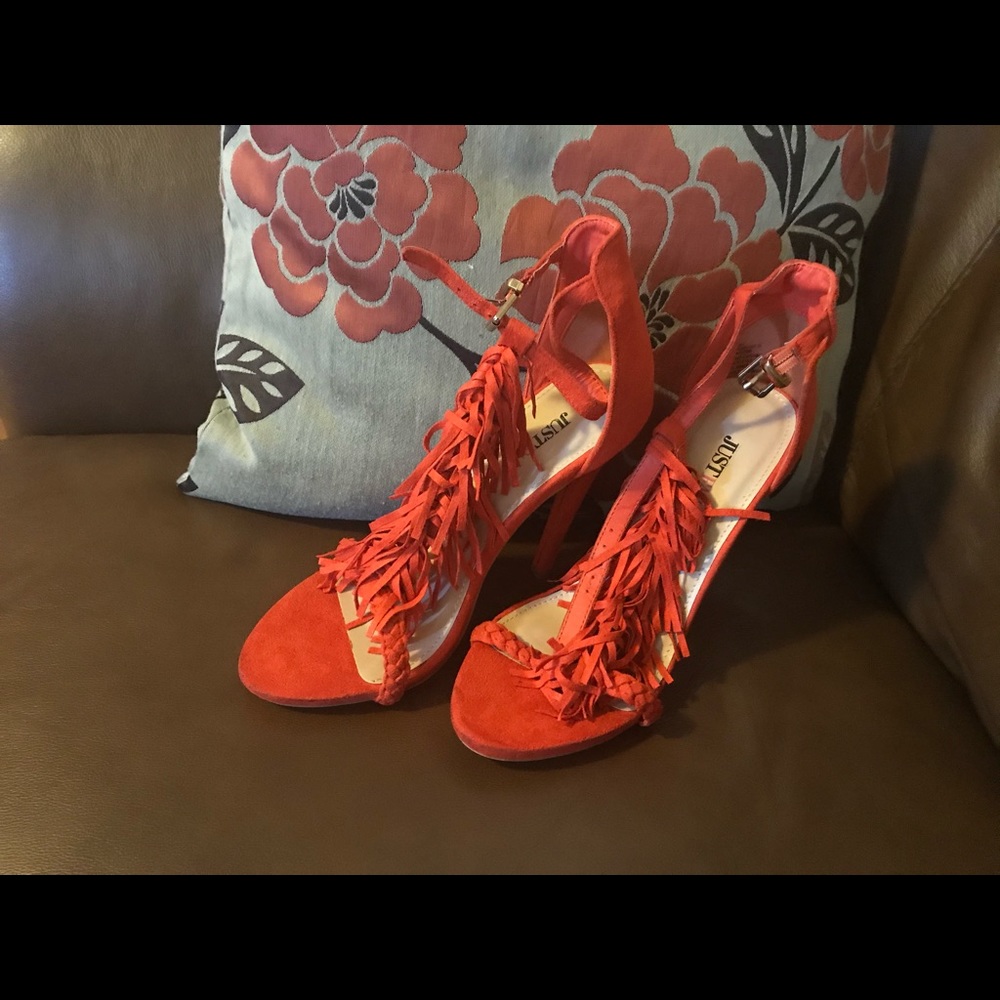 Orange shoes with fringes strap